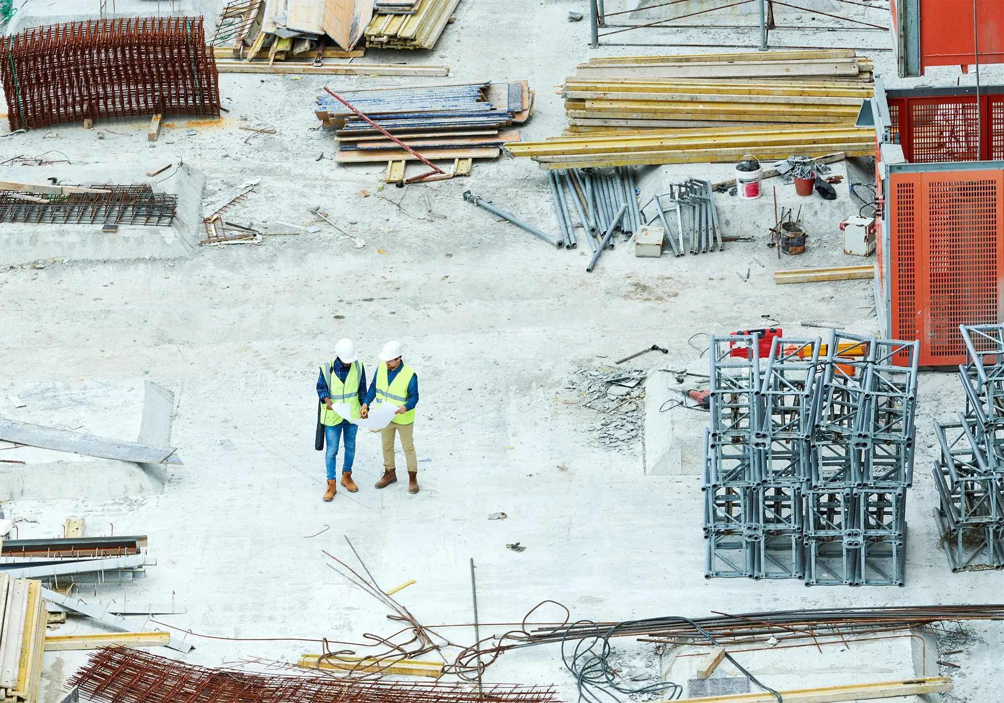 building-inspectors-reading-blueprint-on-construct-2025-03-08-17-11-21-utc
